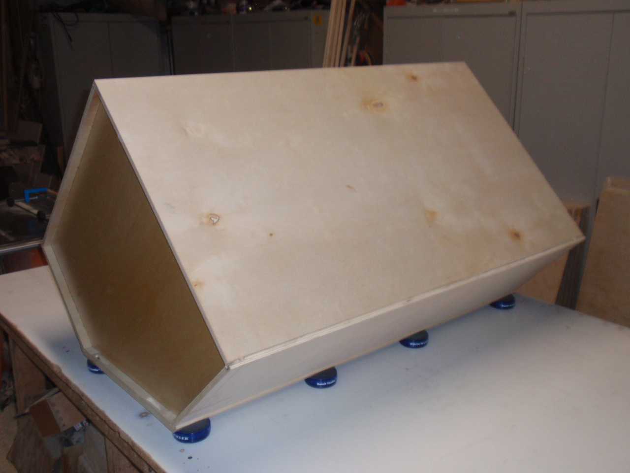 Assembling backs on a wall angle cabinet
