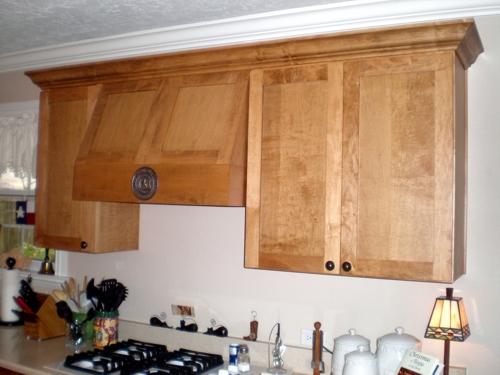 Custom cabinetry photo of a mission style vent hood