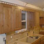 Topping your cabinets with spindel rails is making a come back in cabinetry.  These have always looked better in a multi-piece stack moulding than they do as a stand alone trim.